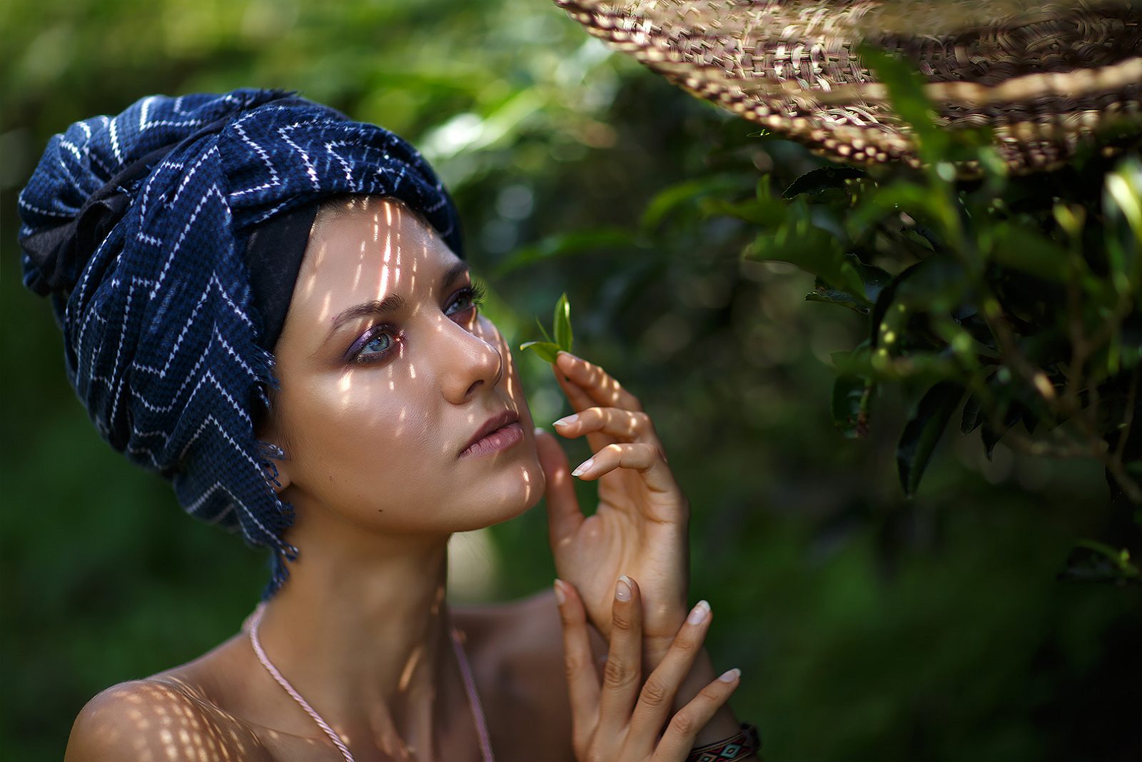 Portrait of a woman in a blue turban in leaf shade